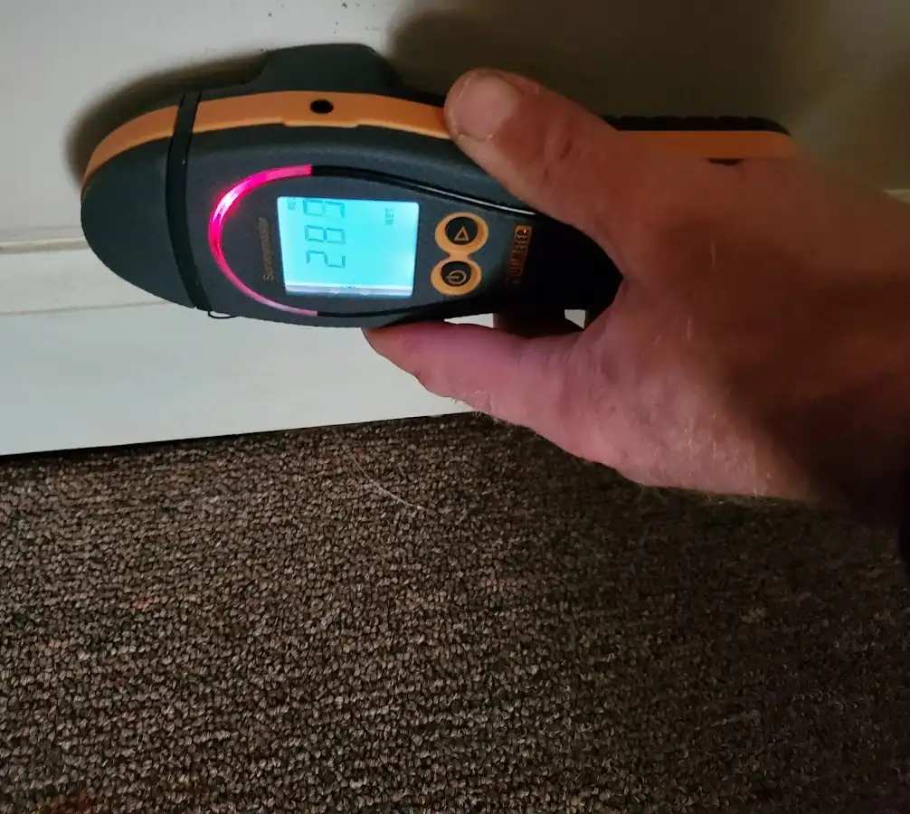 Moisture detection at baseboard during Storm Damage Restoration in Grover Beach